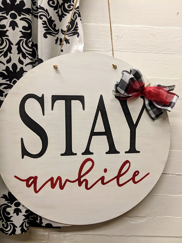 Door hanger Stay awhile