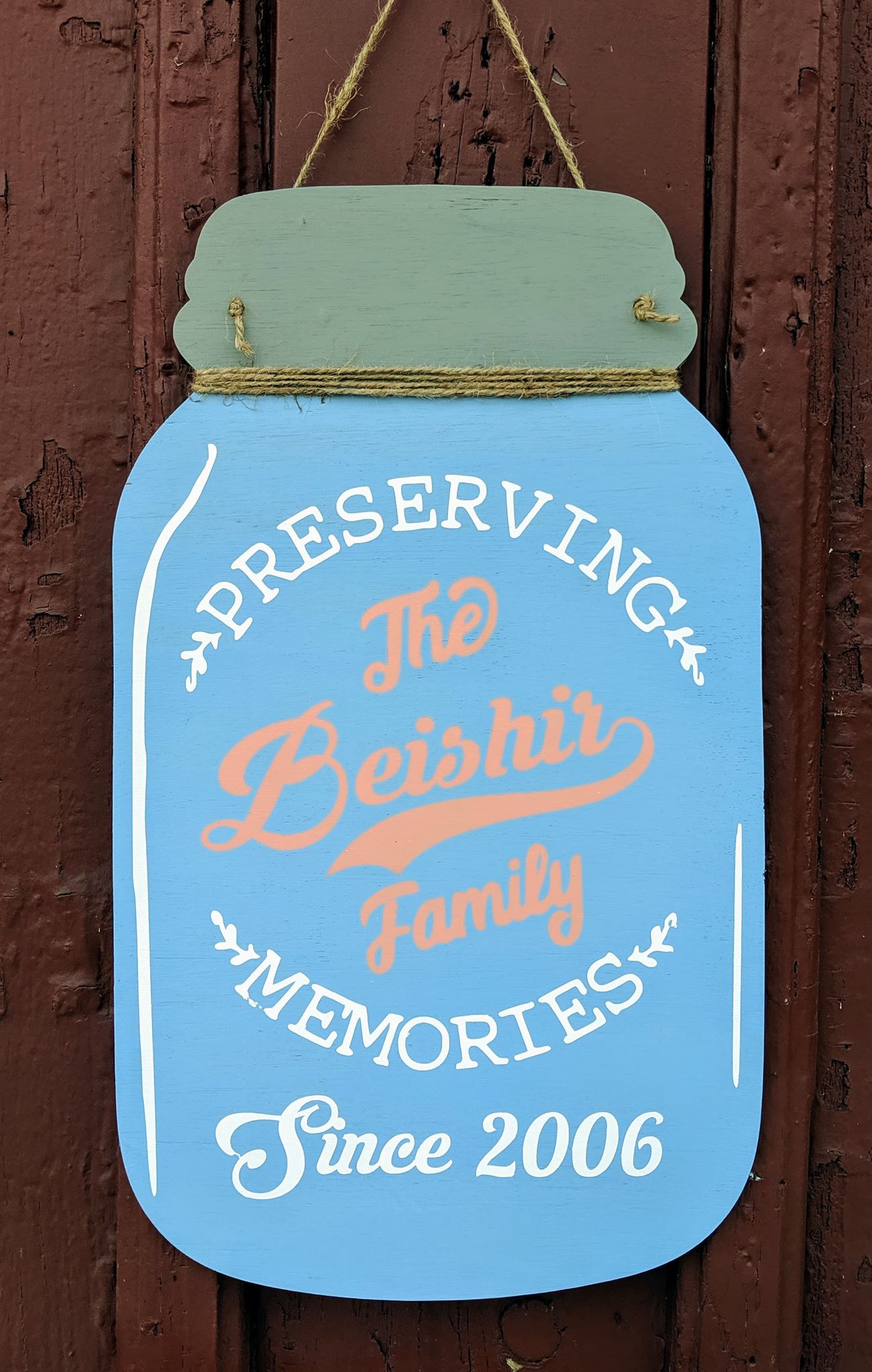 Door hanger mason jar preserving family name and date