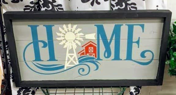 Home with windmill and barn