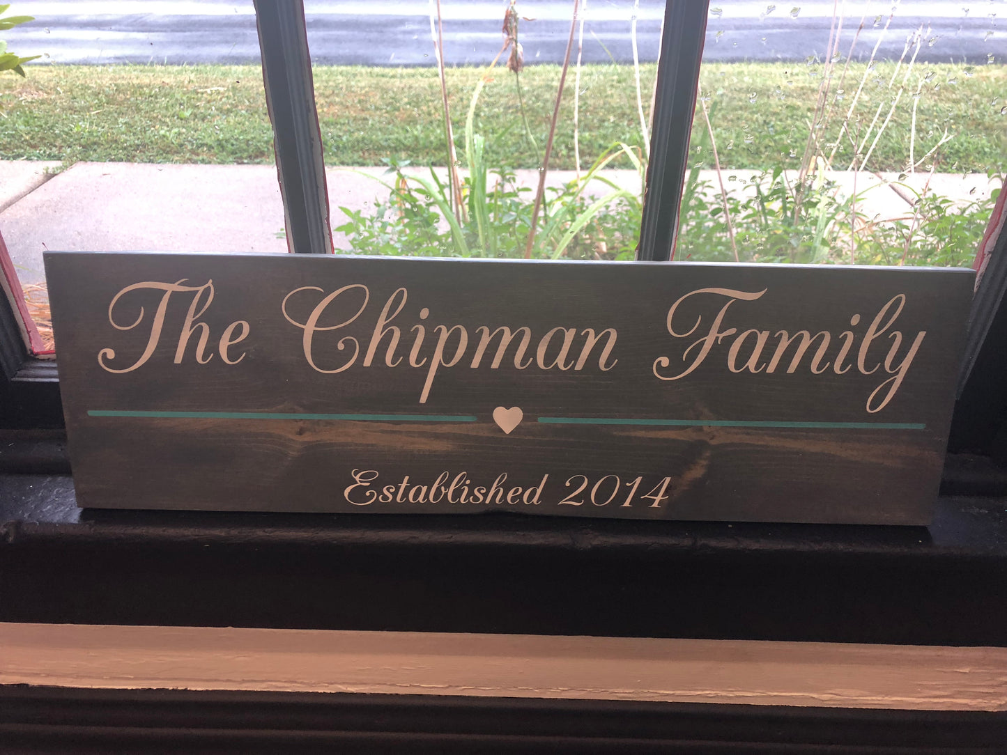 Family last name with line and heart est