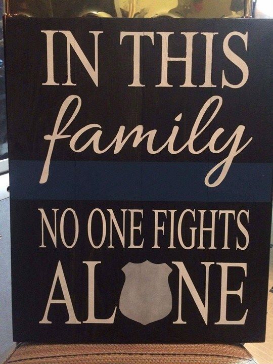 In this family no one fights alone-police badge in alone