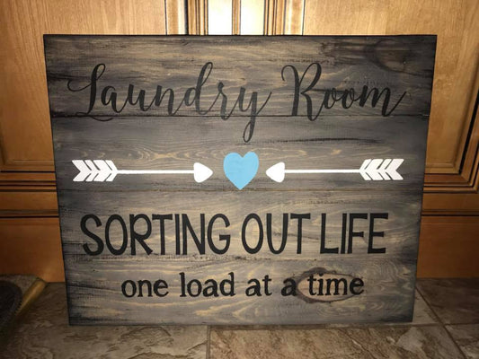 Laundry room sorting out life one load at a time with arrows