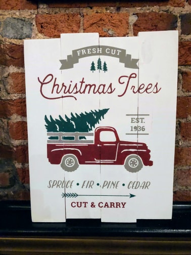 Fresh cut Christmas trees with truck