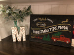 Christmas tree farm with truck family name and est date